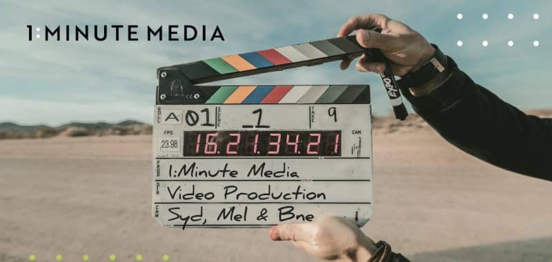 Video Producer's hands with clapper board saying 1 Minute Media Video Production Syd, Mel, Bne